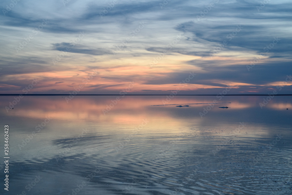 Salt lake. Evening sunset with beautiful sky and water.