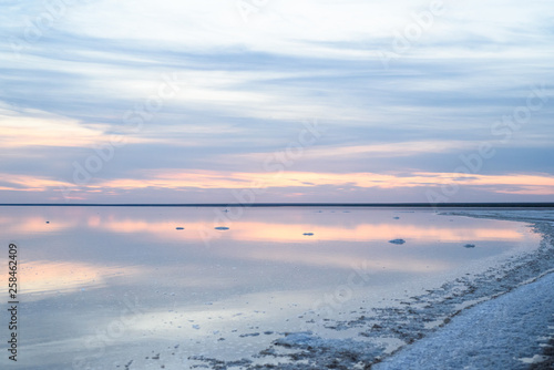 Salt lake. Evening sunset with beautiful sky and water.