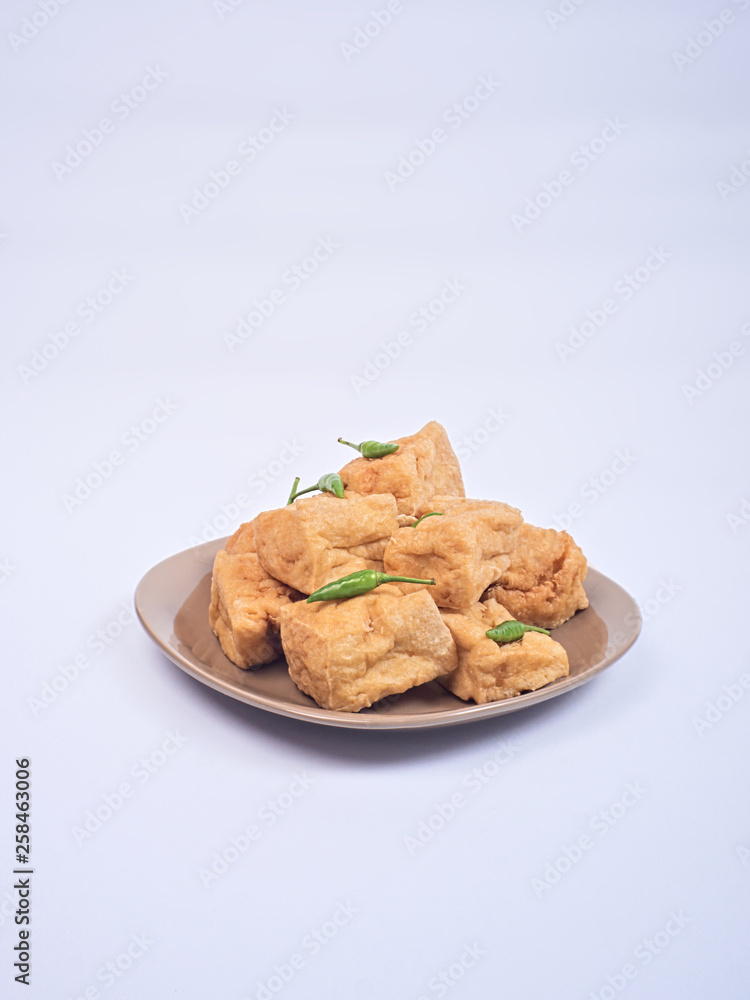 Fried tofu or tahu with petis sauce and chili, javanese traditional indonesian snack Fried tofu or tahu with petis sauce and chili, javanese traditional indonesian snack