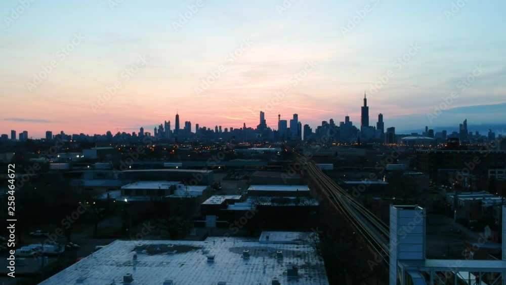 Chicago Illinois/United States March 29th 2019: drone footage of an urban community near downtown Chicago over by the CTA Train stop. a complete view of the Chicago skyline during sunrise Chicago Illinois/United States March 29th 2019: drone footage of an urban community near downtown Chicago over by the CTA Train stop. a complete view of the Chicago skyline during sunrise