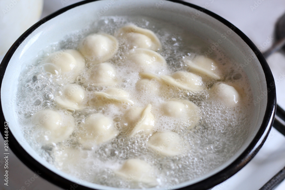 meat dumplings are boiled in a pot of boiling water meat dumplings are boiled in a pot of boiling water