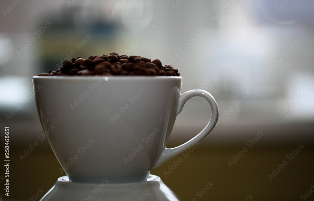 Fototapeta premium Fried coffee beans close-up - excellent morning breakfast. Black Espresso.