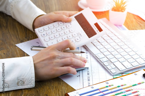 Women's hands with items for business on the table