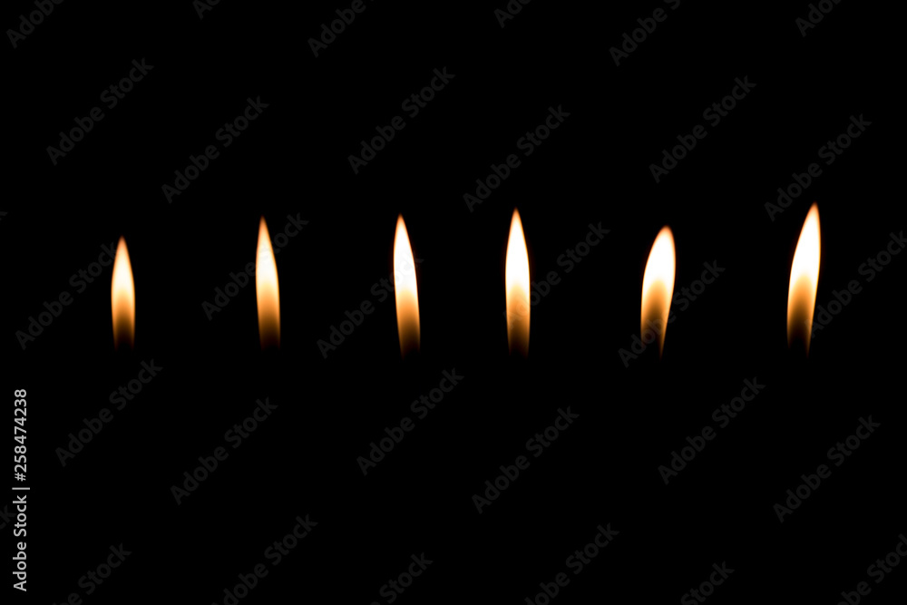 narrow flame, fire lighter on a black background 