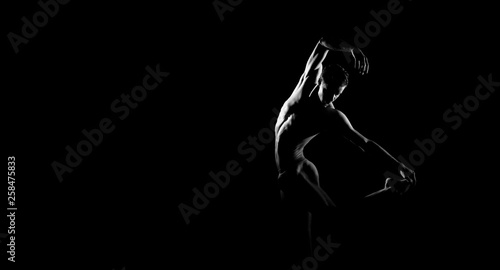 Black and white silhouette of male ballet dancer. Long monochrom horizontal image. © Acronym