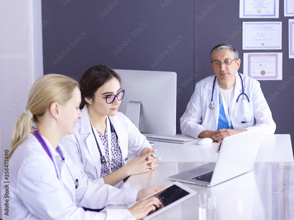 Doctors having a medical discussion in a meeting room Doctors having a medical discussion in a meeting room