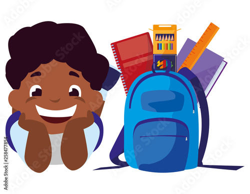 happy little black schoolboy with schoolbag and supplies