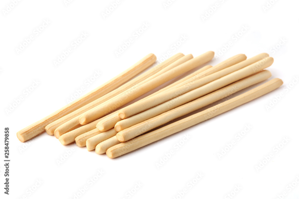 Bread sticks isolated on white background. Pile of crunchy bread sticks.