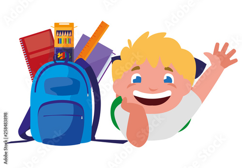 happy little schoolboy with schoolbag and supplies