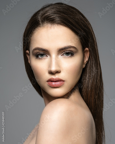 Portrait of beautiful young brunette woman with clean face.