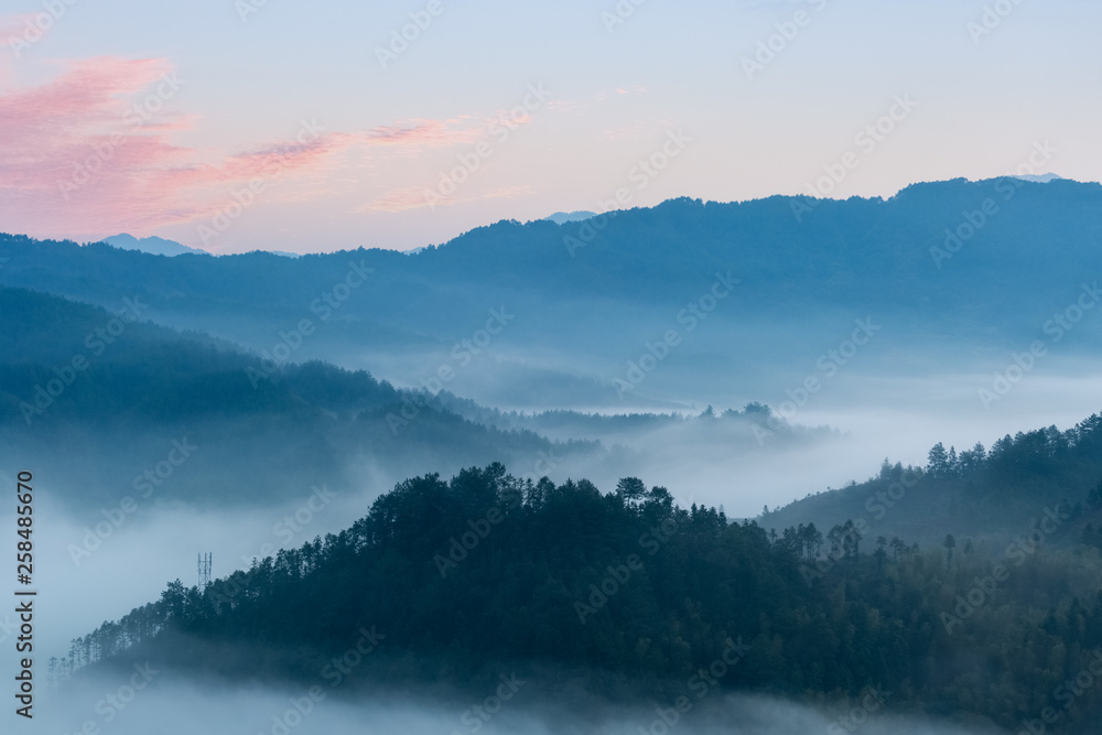 rosy clouds and misty blue mountains