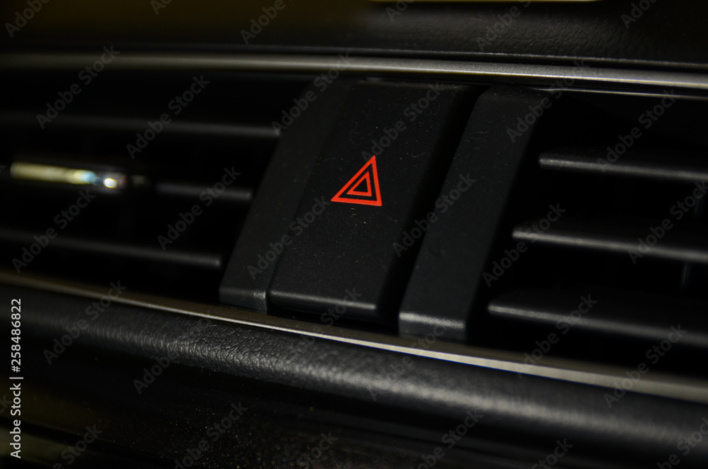 Emergency button close up macro shot on Malaysian car dashboard. Emergency button close up macro shot on Malaysian car dashboard.