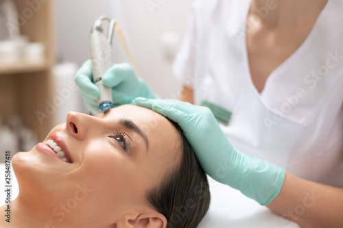 Close up of medical procedure of cleaning face