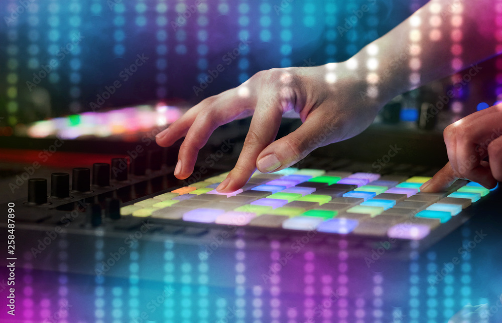 Fototapeta premium Hand mixing music on dj controller with social media concept icons 