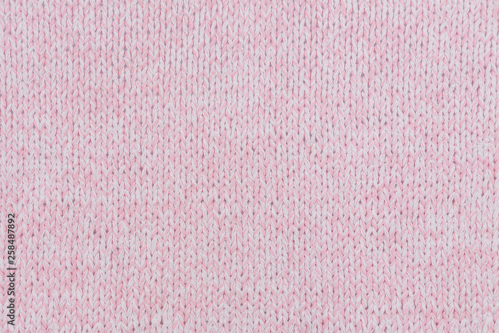 Fototapeta premium beautiful pink knitted fabric on the background