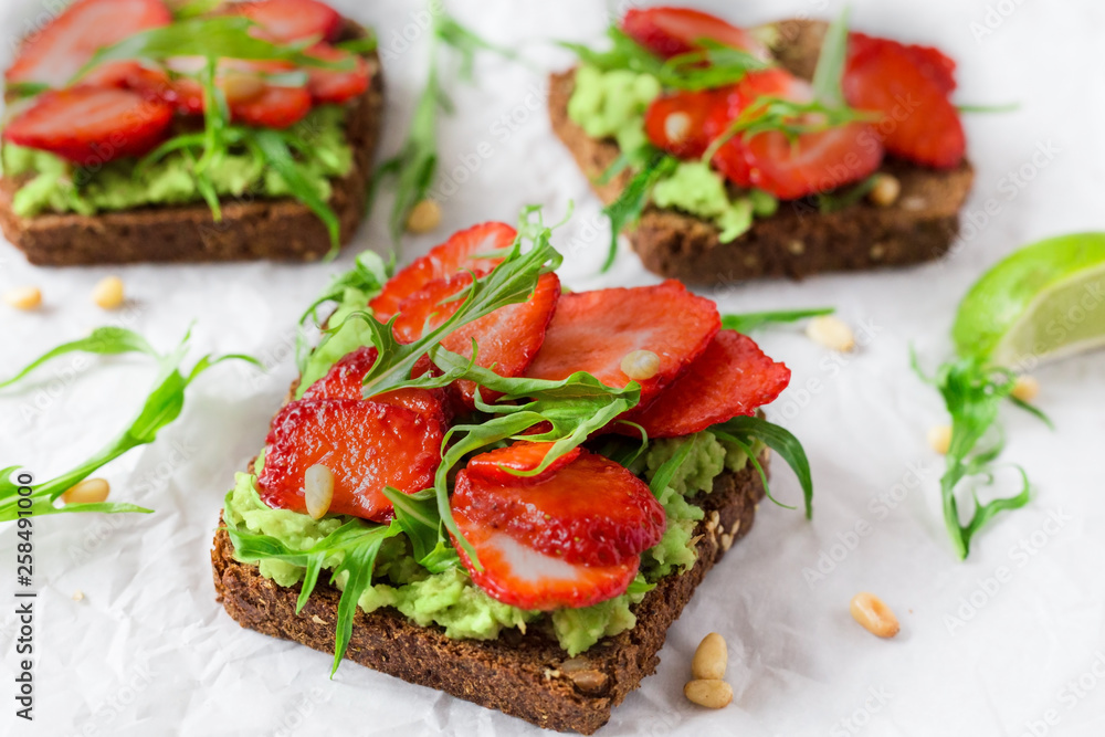 bruschetta,toast,lunch,breakfast,food,healthy,arugula,slice,avocado,background,bread,fresh,strawberry,snack,delicious,sandwich,red,view,top,diet,meal,eating,fruit,appetizer,white,organic,tasty,vegetar