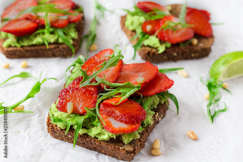 bruschetta,toast,lunch,breakfast,food,healthy,arugula,slice,avocado,background,bread,fresh,strawberry,snack,delicious,sandwich,red,view,top,diet,meal,eating,fruit,appetizer,white,organic,tasty,vegetar