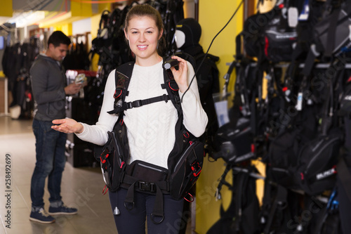 Woman is standing in new equipment for diving