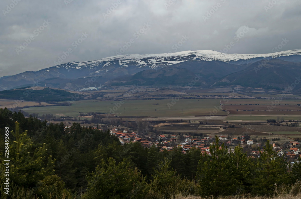 Part of the Zlatitsa Pirdop valley and residential district of village Chavdar close in background of the snowy Balkan mountain, Sofia, Bulgaria, Europe Part of the Zlatitsa Pirdop valley and residential district of village Chavdar close in background of the snowy Balkan mountain, Sofia, Bulgaria, Europe