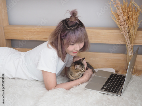 beautiful woman play with cat feel relaxing. 