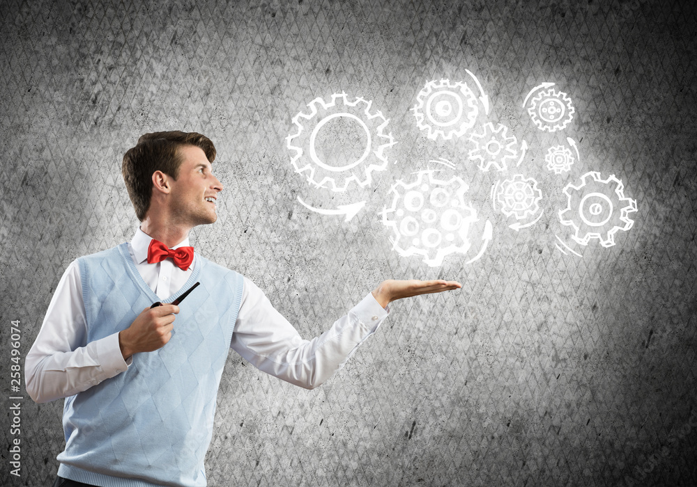 Elegant banker wearing red tie and gears as teamwork concept Elegant banker wearing red tie and gears as teamwork concept