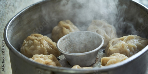 Uzbek national food manta  like dumplings  in a steamer  steamed food.