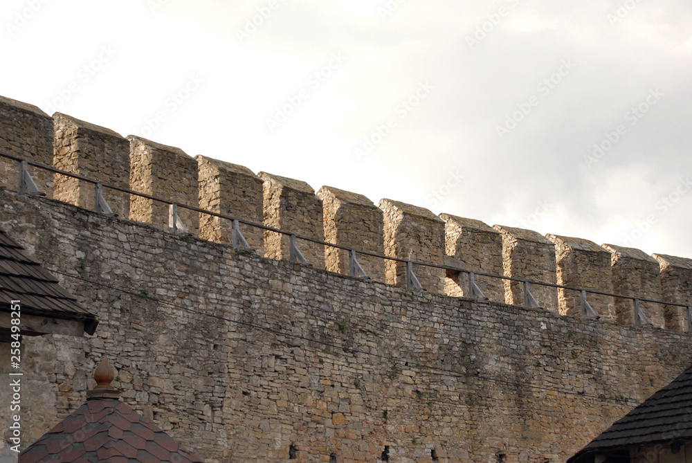 An old medieval fortress. Stone wall and elements of the fortress.