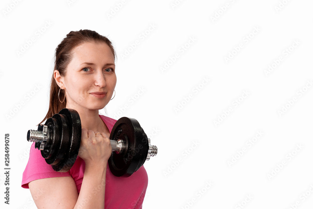 Fototapeta premium portrait of a woman with dumbbells on a white background
