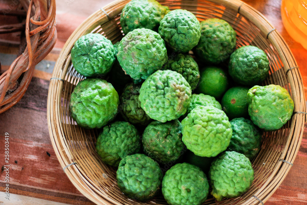 Fototapeta premium Close up green fresh Bergamot in basket. 