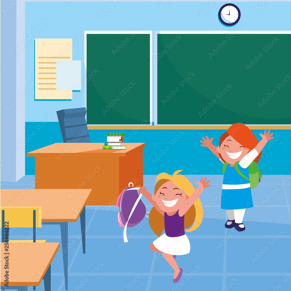 happy little school girls in the classroom happy little school girls in the classroom