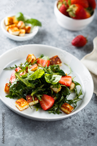Arugula salad with strawberry and grilled cheese © marysckin