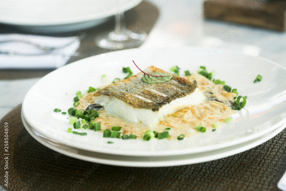 White fish fillet with onion sauce