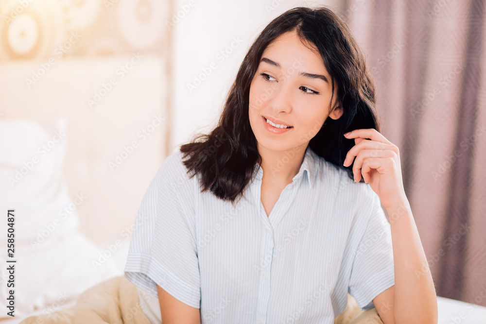 Beautiful Positive woman sitting in bed in morning Beautiful Positive woman sitting in bed in morning