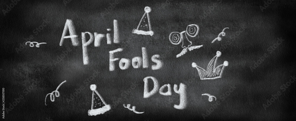 doodle of april fools day with cartoon element on black chalkboard background concept doodle of april fools day with cartoon element on black chalkboard background concept