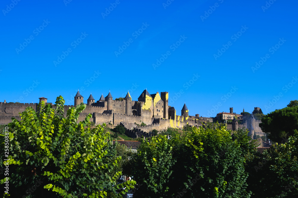 Wonderful medieval city of Carcassonne with yellow sign of tour de France