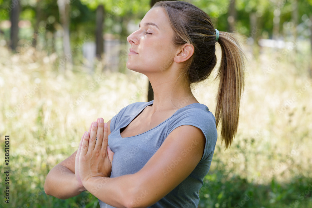 picture of calm woman doing yoga position picture of calm woman doing yoga position