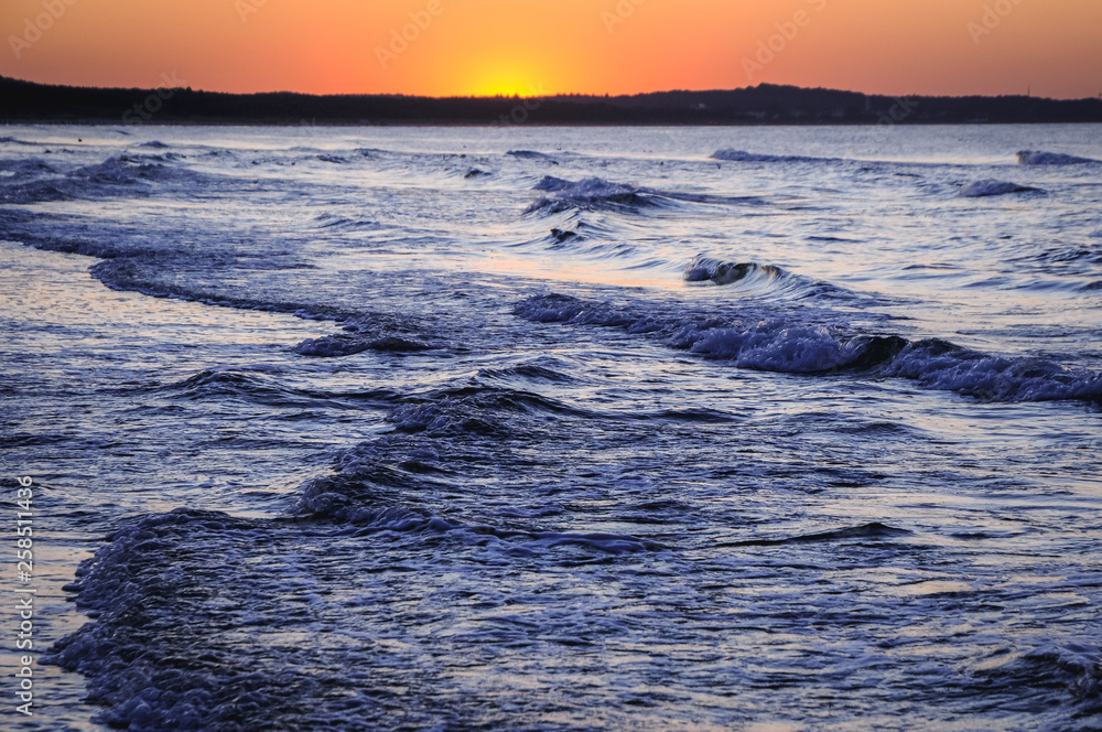 Sunset over Baltic Sea seen from beach in Swinoujscie coastal city in West Pomeranian Poland