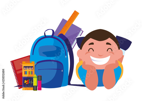 happy little schoolboy with schoolbag and supplies