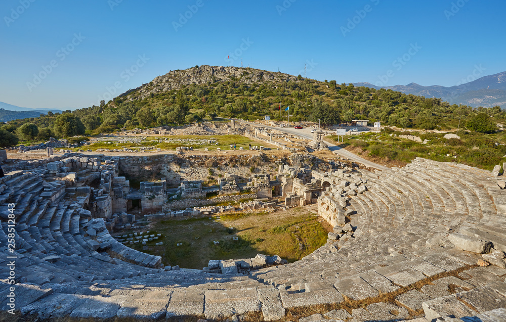 Naklejka premium Amphitheatre in Letoon - sanctuary of goddess Leto near the ancient Lycian city Xanthos.