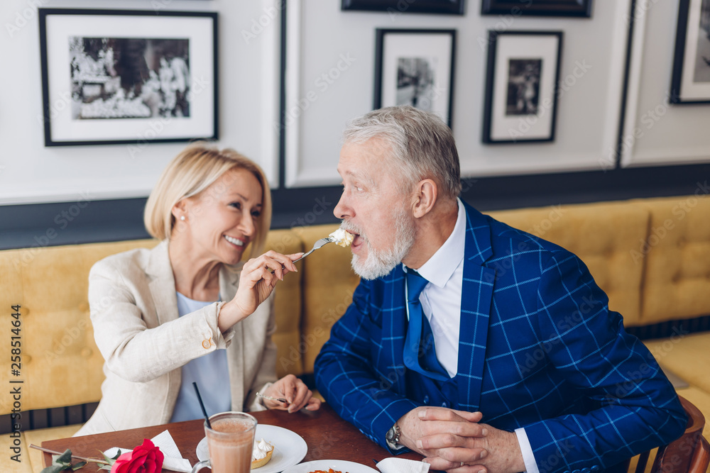 lovely couple enjoying meal in the cafe. close up photo. happy old age lovely couple enjoying meal in the cafe. close up photo. happy old age