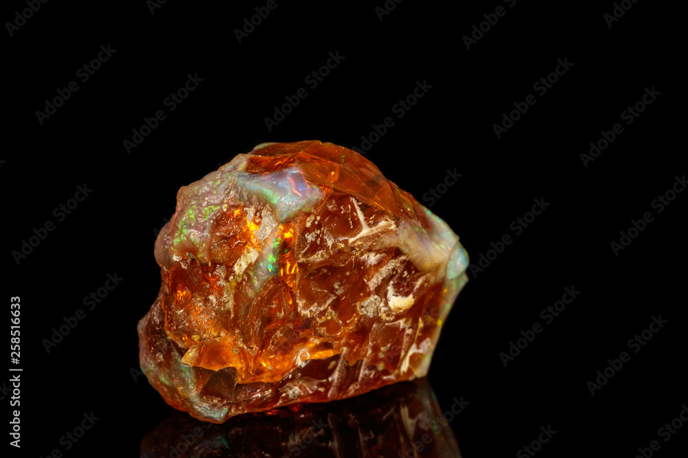 Macro stone Opal mineral in rock on a black background close up Macro stone Opal mineral in rock on a black background close up