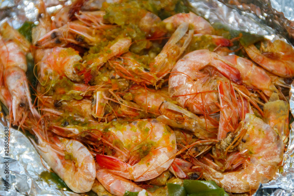 Close-up of shrimps baked in foil Close-up of shrimps baked in foil