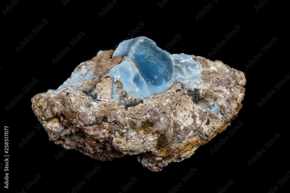 Macro stone Opal mineral in rock on a black background close up Macro stone Opal mineral in rock on a black background close up