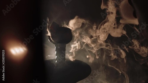 thick white smoke from a hookah on a black background