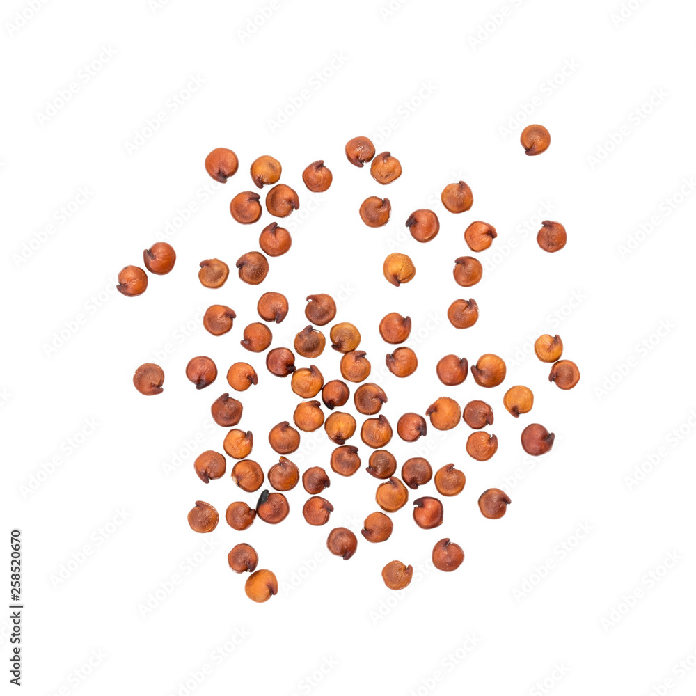 Some spread out red quinoa seeds seen directly from above and isolated on white background Some spread out red quinoa seeds seen directly from above and isolated on white background