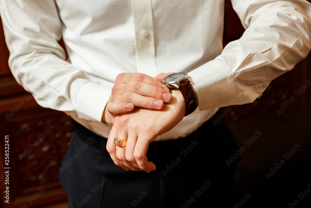 man puts a watch on his hand man puts a watch on his hand