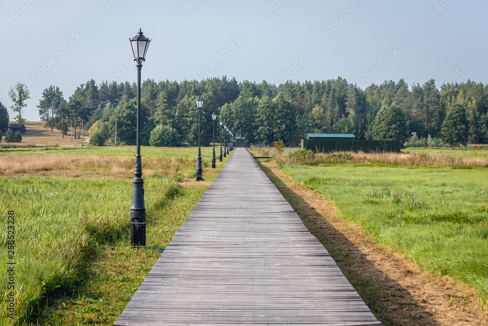Wooden path to Orthodox skete - monastic community in Odrynki, small village in Podlasie region of Poland