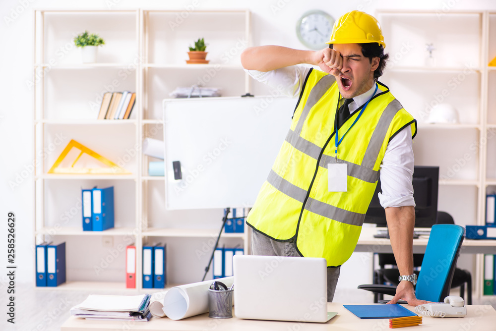 Male construction engineer working in the office Male construction engineer working in the office