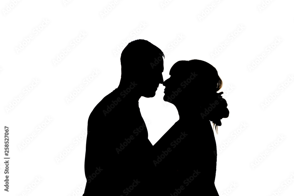 kissing couple. Black silhouettes on white background. In isolation. couple kisses