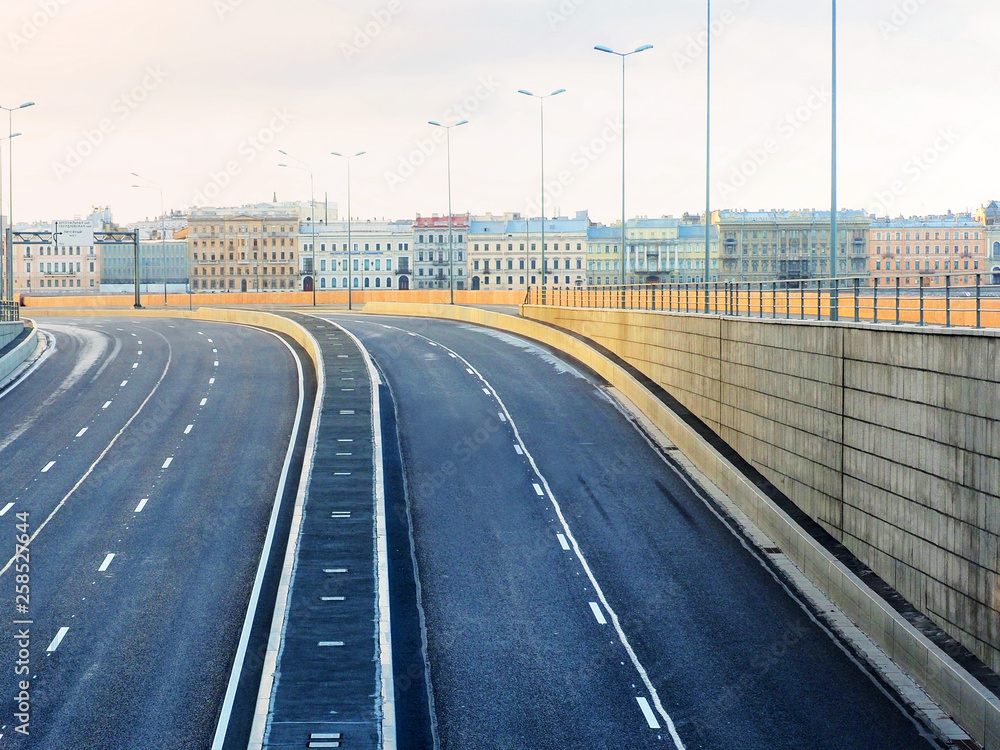 Dawn, deserted streets and road of the ancient city. Saint Petersburg, Neva river shore, tunnel